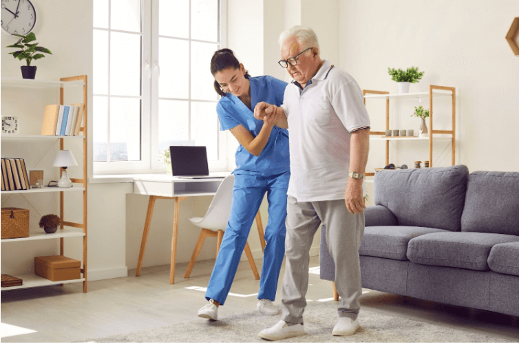 Nursing Home Care: Lady helping old man at nursing home